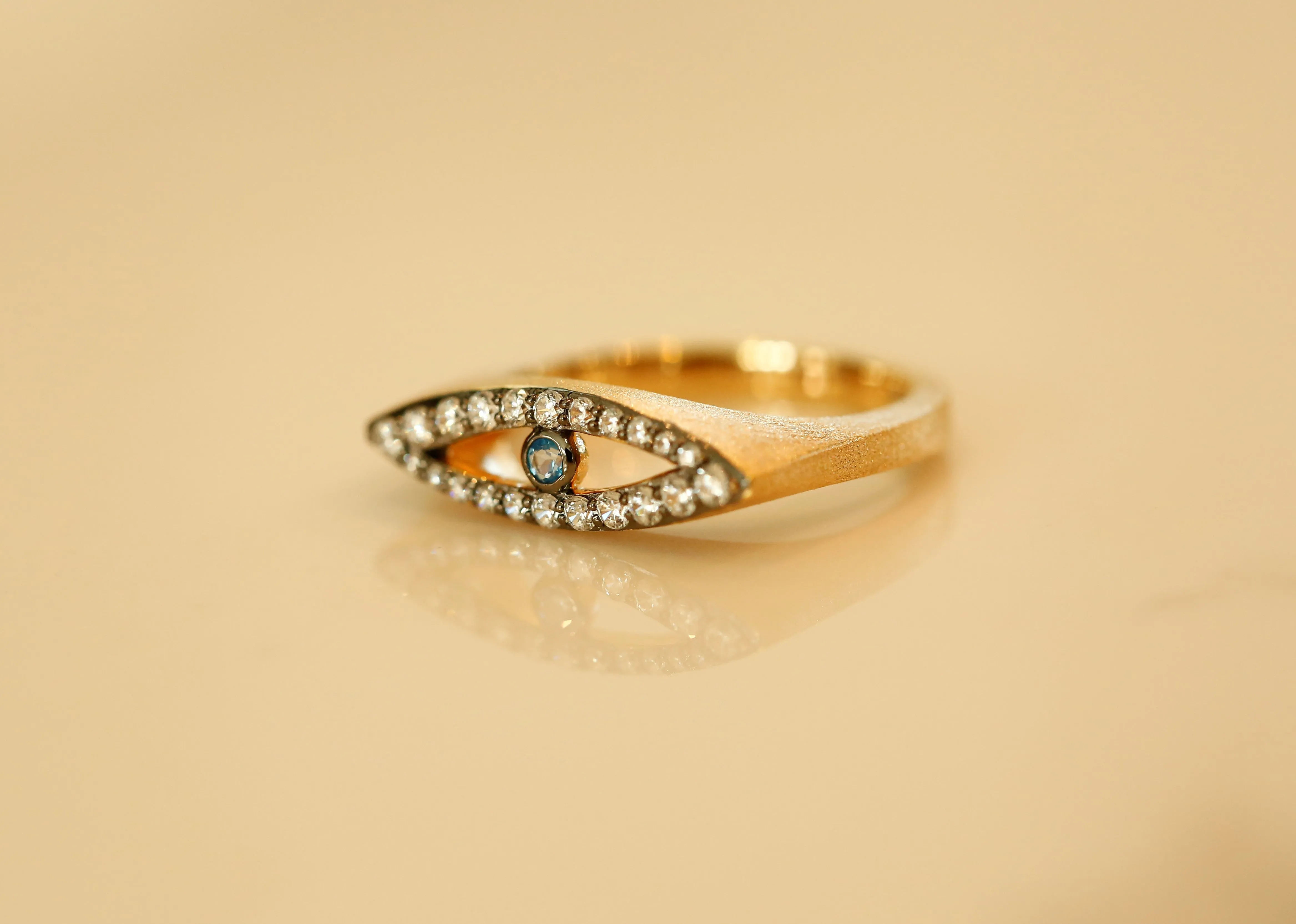 AMMANII Studded Evil Eye Ring with Blue Topaz Center in Vermeil Gold